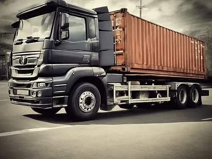 Truck carrying a shipping container